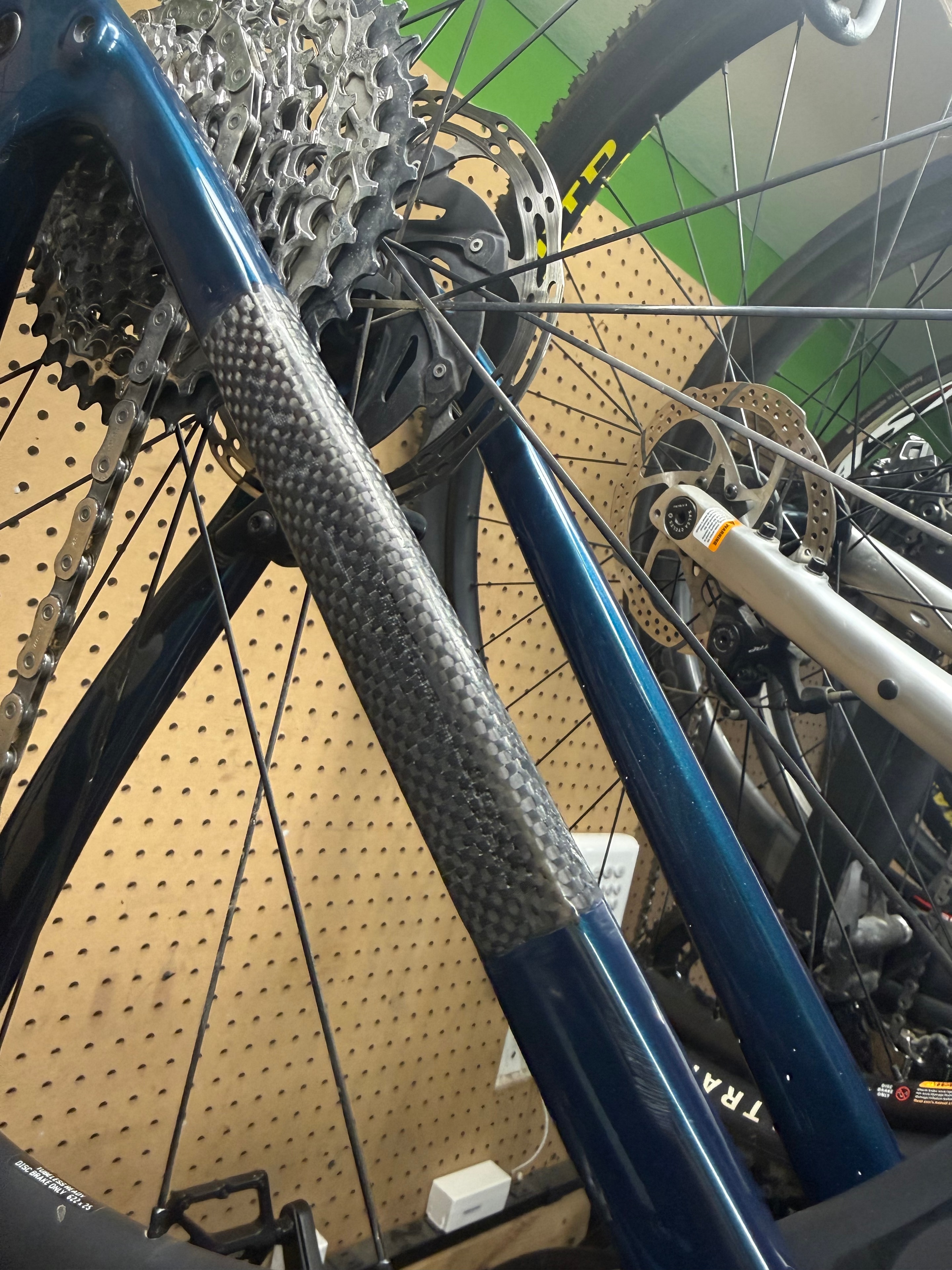 Structural carbon fiber repair on a bicycle seat stay — close-up of repair area